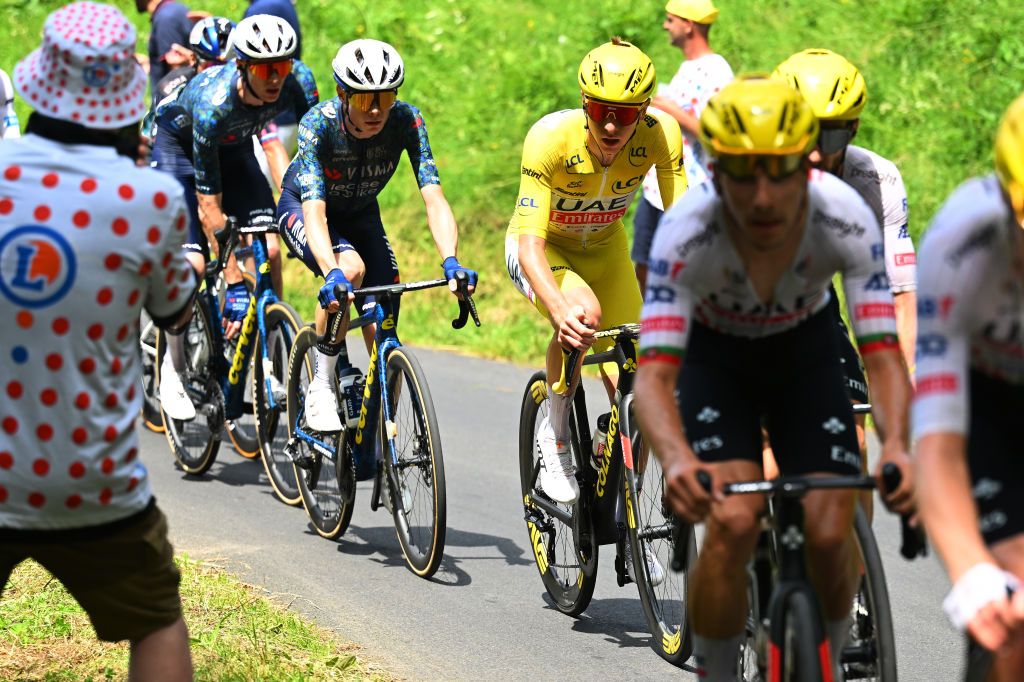 LELIORAN FRANCE JULY 10 LR Jonas Vingegaard Hansen of Denmark and Team Visma Lease a Bike and Tadej Pogacar of Slovenia and UAE Team Emirates Yellow Leader Jersey compete during the 111th Tour de France 2024 Stage 11 a 211km stage from EvauxlesBains to Le Lioran 1239m UCIWT on July 10 2024 in Le Lioran France Photo by Tim de WaeleGetty Images