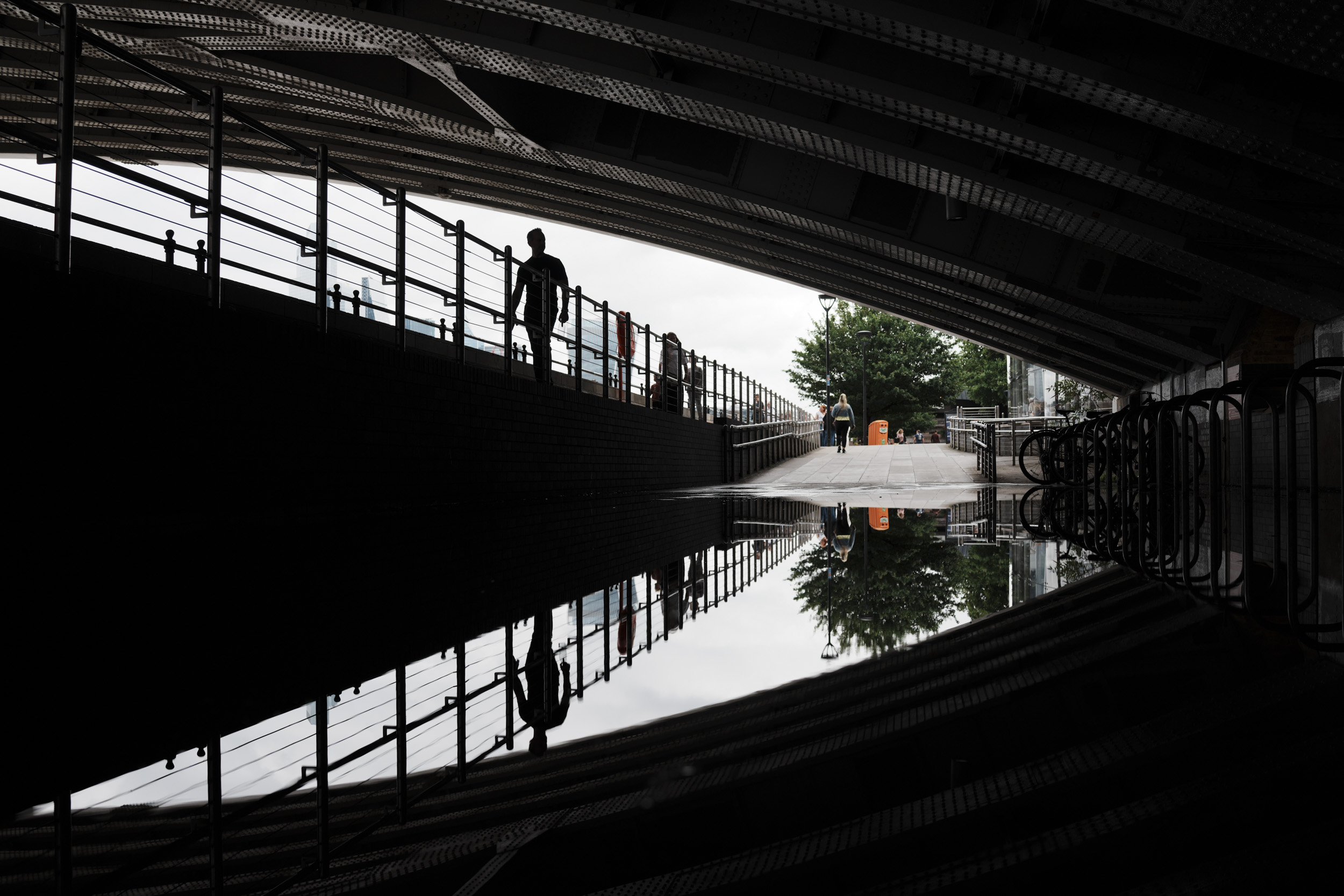 Sony RX1R III sample gallery: flooded sidewalk under a bridge, reflected