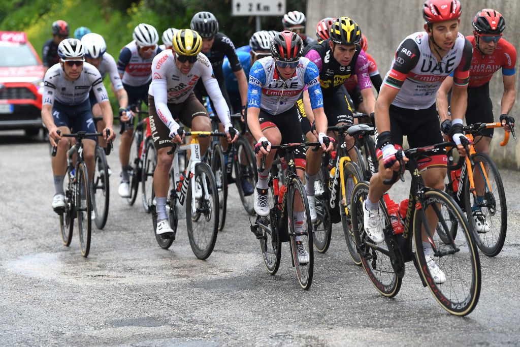 CASTELFIDARDO ITALY MARCH 14 Joao Almeida of Portugal and Team Deceuninck QuickStep White Best Young Rider Jersey Greg Van Avermaet of Belgium and AG2R Citren Team Tadej Pogacar of Slovenia and UAE Team Emirates Blue Leader Jersey Wout Van Aert of Belgium and Team Jumbo Visma Purple Sprint Jersey Davide Formolo of Italy and UAE Team Emirates Mikel Landa Meana of Spain and Team Bahrain Victorious during the 56th TirrenoAdriatico 2021 Stage 5 a 205km stage from Castellalto to Castelfidardo 175m TirrenoAdriatico on March 14 2021 in Castelfidardo Italy Photo by Tim de WaeleGetty Images
