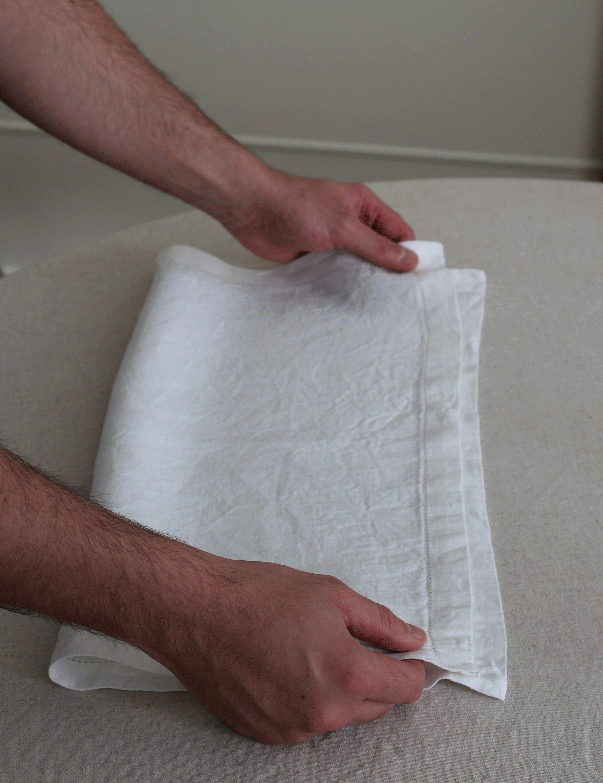 step by step photos of folding a napkin