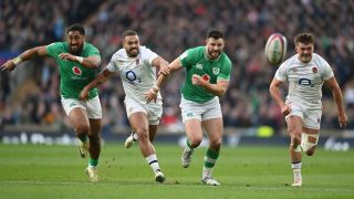 Bundee Aki and Robbie Henshaw battle with Ollie Lawrence and George Furbank of England during the Guinness Six Nations 2024 match between England and Ireland at Twickenham Stadium on March 09, 2024 in London, England