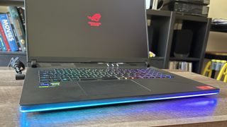 Asus ROG Strix Scar 18 from below, showing RGB light strip along the bottom of the laptop