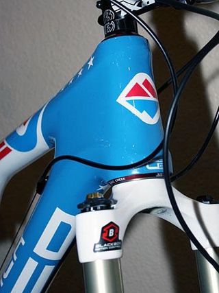 The red, white and blue theme carries through right to the head tube badge.