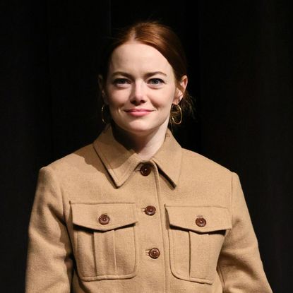 Emma Stone speaks on stage about 'Open Things' in 2023