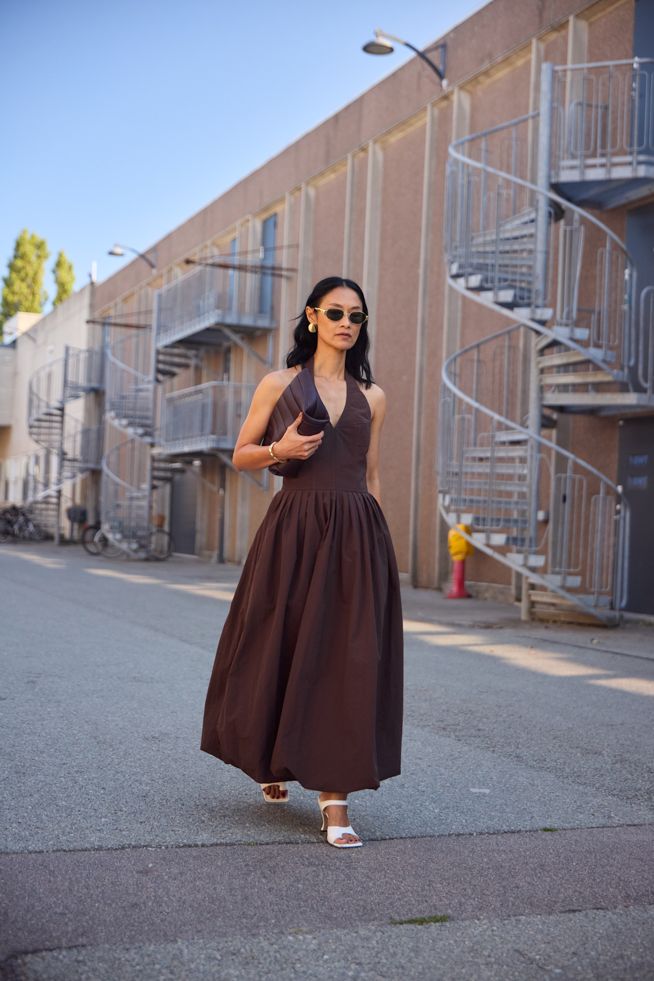 woman wearing brown dress and white heels