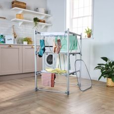 Aldi heated airer in a pink utility room