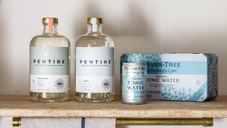 Two bottles of Pentire spirits on a shelf with Fever Tree tonic water