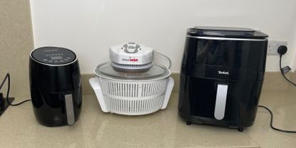 Image of air fryer and halogen oven side by side on countertop during testing