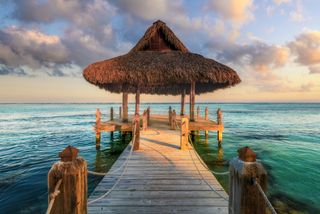 Palapa and wooden pier on the Carribean Sea, Dominican Republic