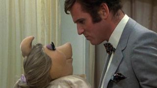 Miss Piggy and Charles Grodin in The Great Muppet Caper