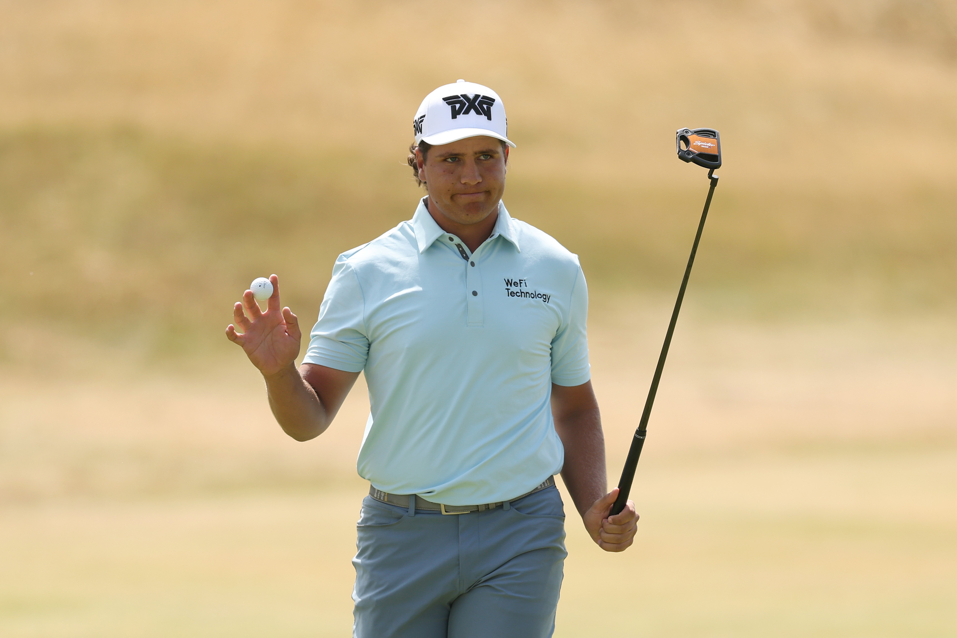 Aldrich Potgieter waves to the crowd during round two of The Open Championship 2026