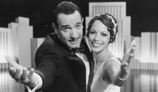 Jean Dujardin and Bérénice Bejo throw their arms out to the audience in The Artist.
