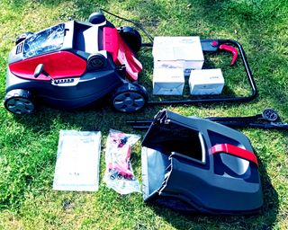 Mountfield lawn mower components unboxed on lawn