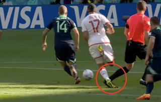 Daniel Siebert appears to trip a Tunisian player during Australia's attack