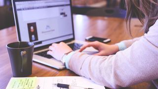 Man’s hands as he conducts an online search