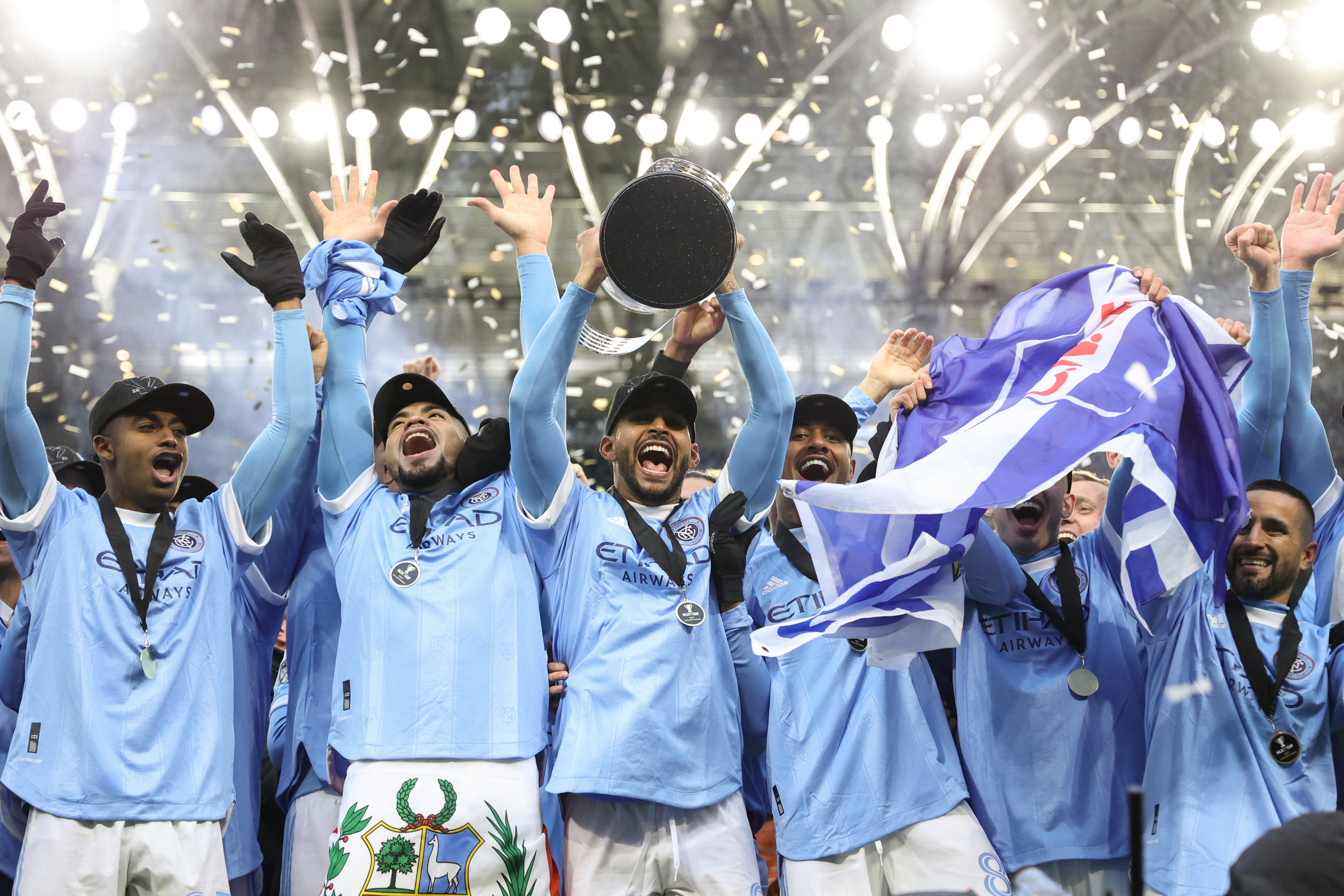 New York City FC players celebrate after beating Portland Timbers on penalties to win the MLS Cup in December 2021.