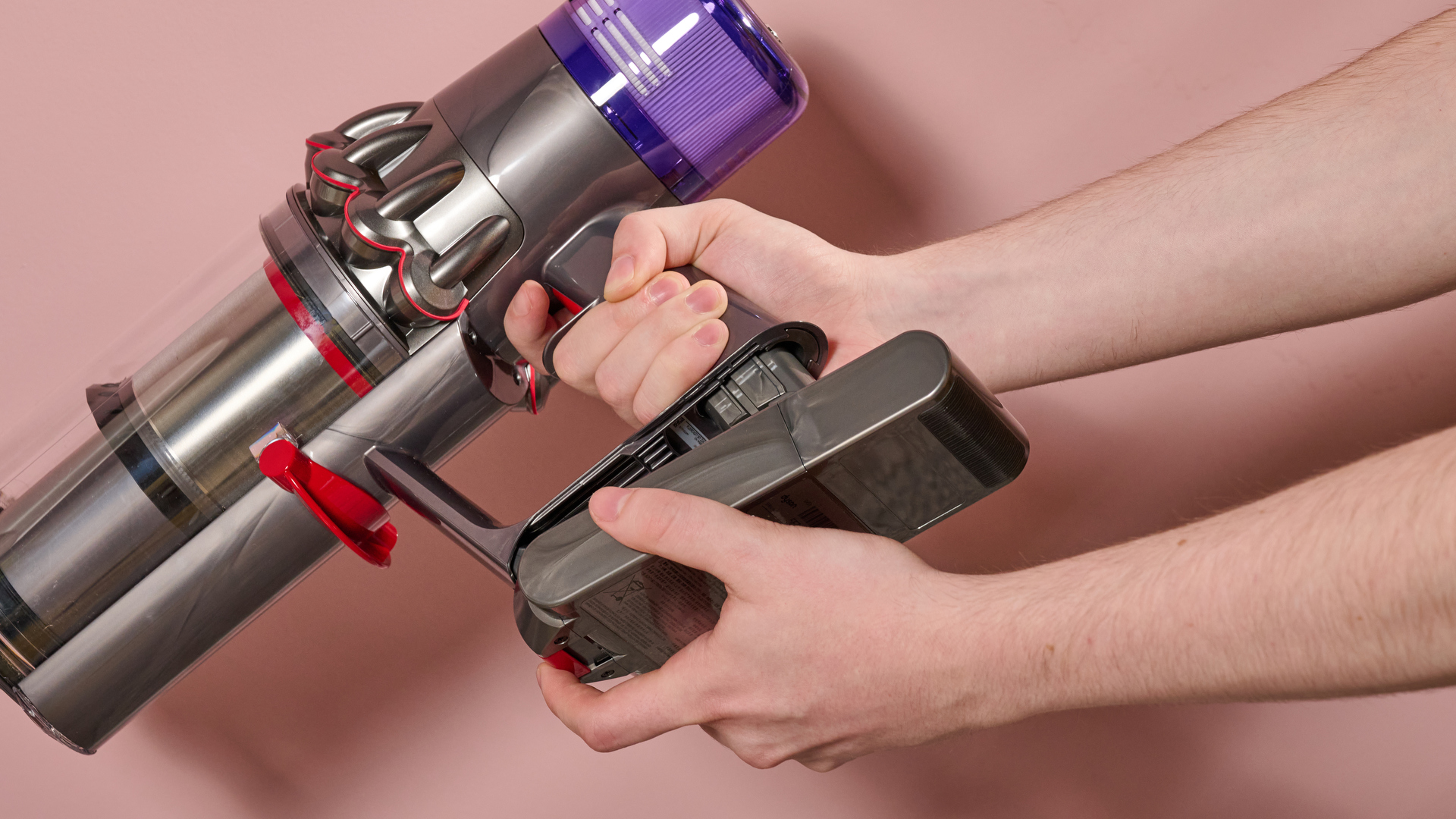 Dyson V11 stick vacuum with battery being removed