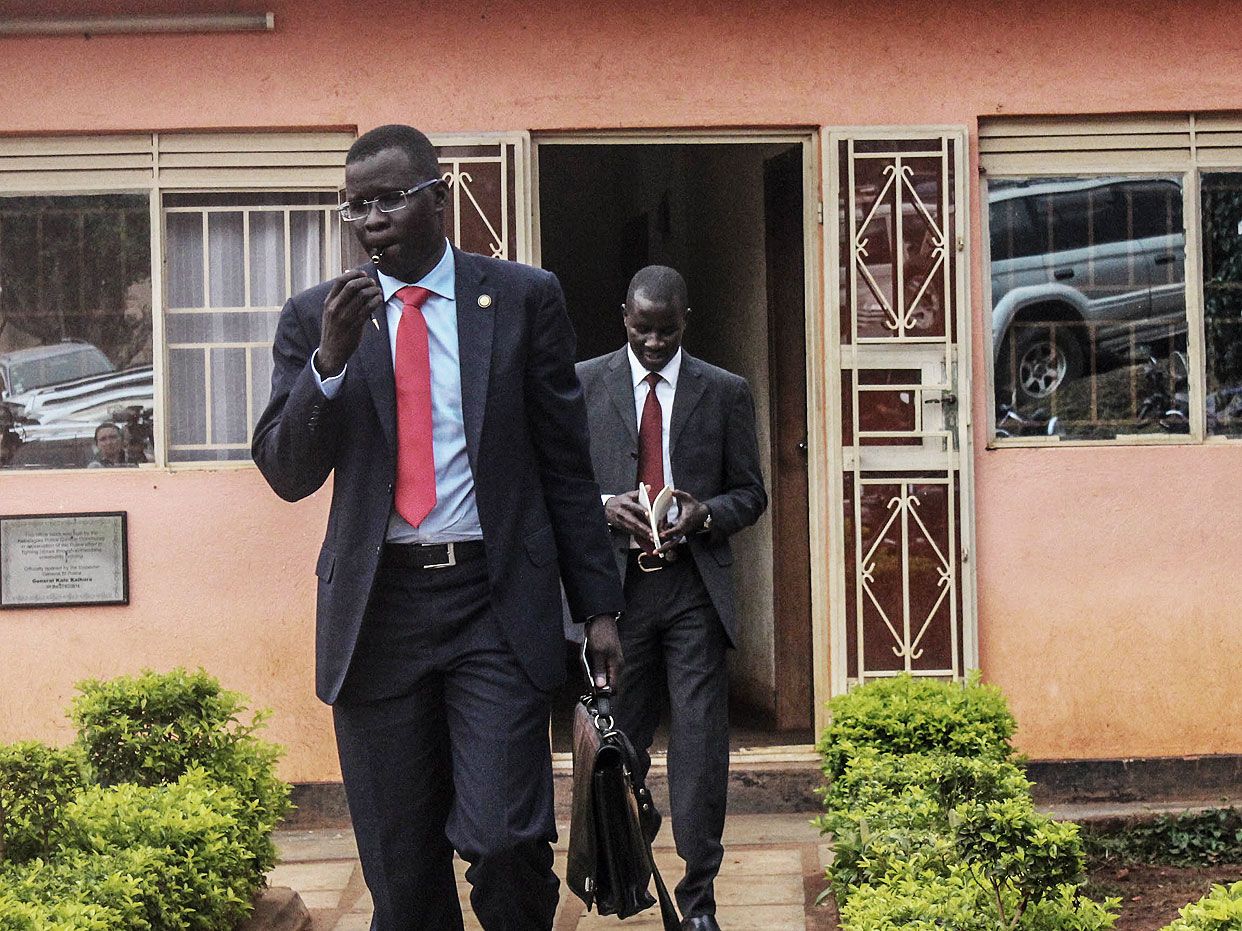 Human rights lawyer Nicholas Opiyo leaves a police station after meeting with minister Simon Lokodo