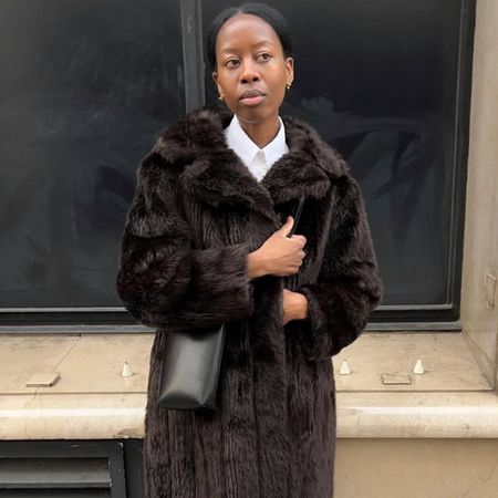 Woman in faux-fur brown coat