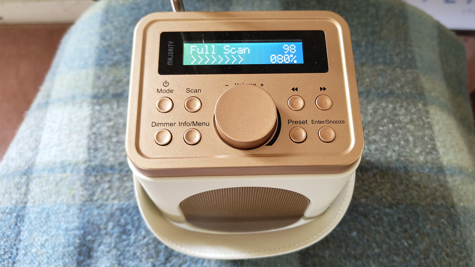 Majority Little Shelford DAB radio on blue and white blanket, top down view showing top controls