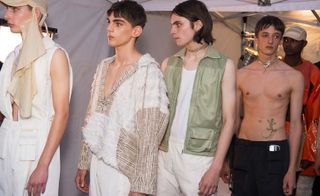 Cottweiler S/S 2018. Models wearing light, white and olive green outfits