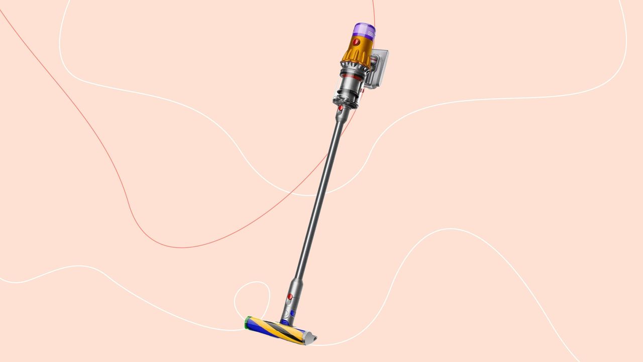 Dyson V12 Detect Slim Absolute on a pink background