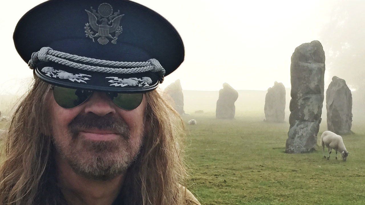 Julian Cope with a sheep and a stone formation