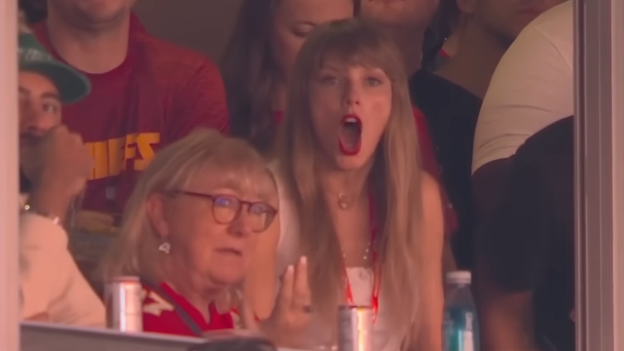 Taylor Swift is shown on the Fox broadcast of the September 24, 2023, Kansas City Chiefs game, with a look of open-mouthed shock. She's sitting next to Donna Kelce in the family's suite.