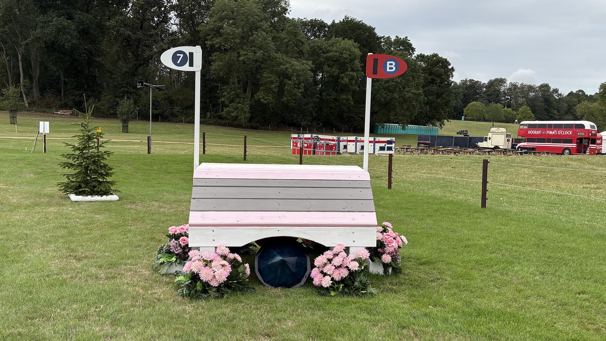 Narrow grey, pink and white fence on the Burghley cross-country course 2026