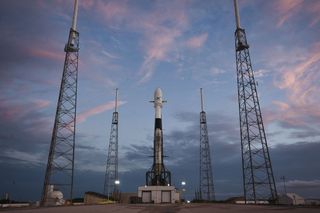 A previously flown Falcon 9 rocket carrying 60 Starlink satellite internet satellites stands atop its launchpad at Cape Canaveral, Florida for a May 15, 2019 launch.