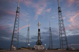 A previously flown Falcon 9 rocket carrying 60 Starlink satellite internet satellites stands atop its launchpad at Cape Canaveral, Florida. Launch is targeted for May 23, 2019.