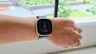 best fitbit Fitbit Versa 3 with blue band on person's wrist