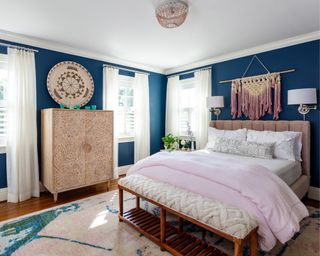 bohemian bedroom with dark blue walls