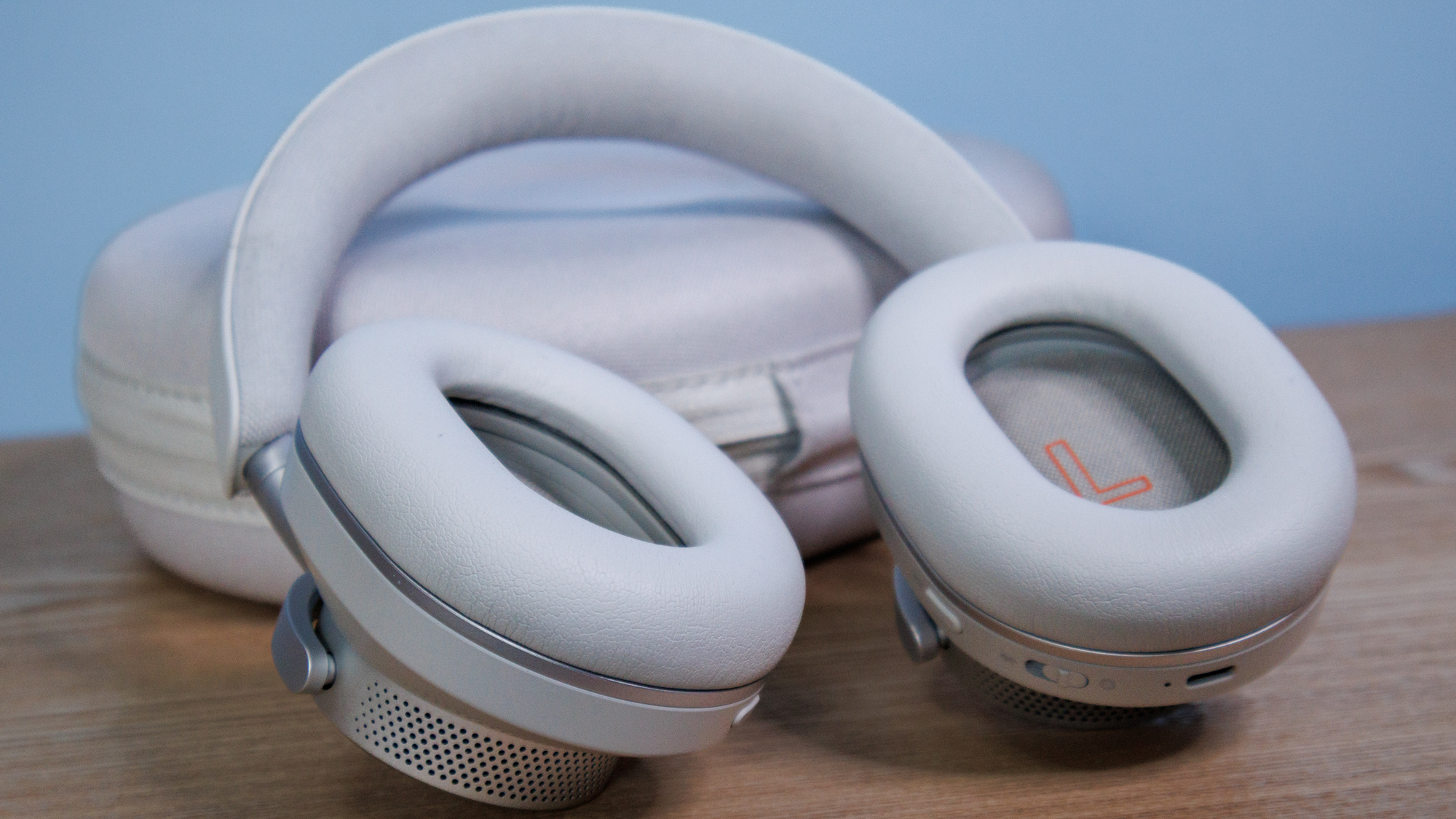 Cambridge Audio Melomania P100 SE headphones and case on a table.