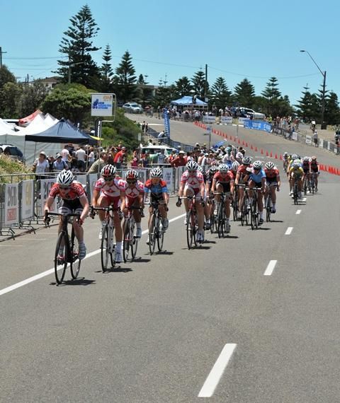 The main bunch rides into the finish
