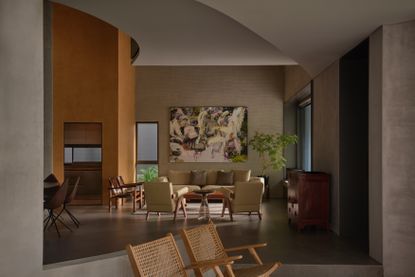 interior of living room in 3d-printed concrete house in singapore with curved block coloured walls