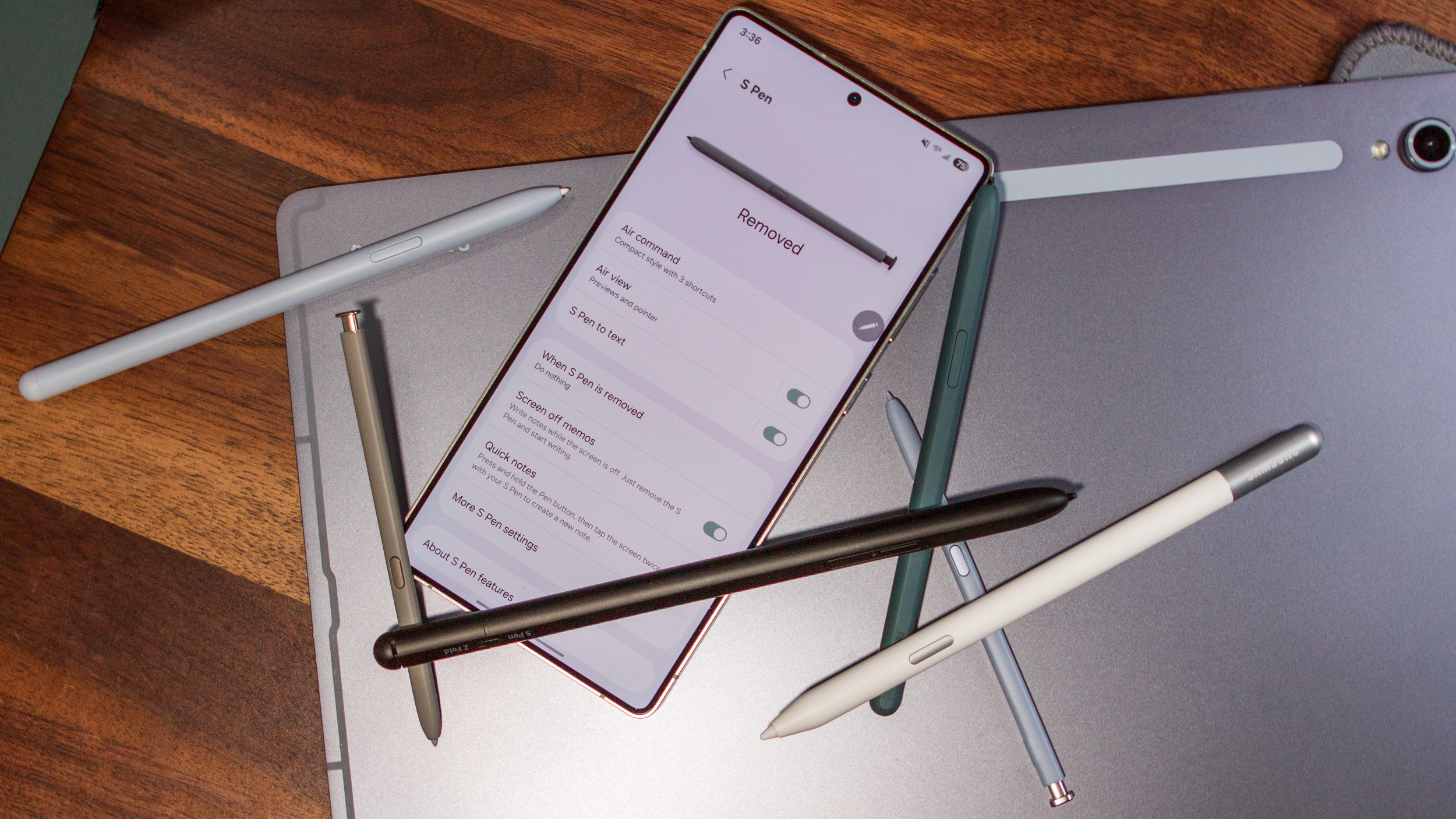 Top-down view of the S Pen settings on the Galaxy S25 Ultra surrounded by different types of S Pens