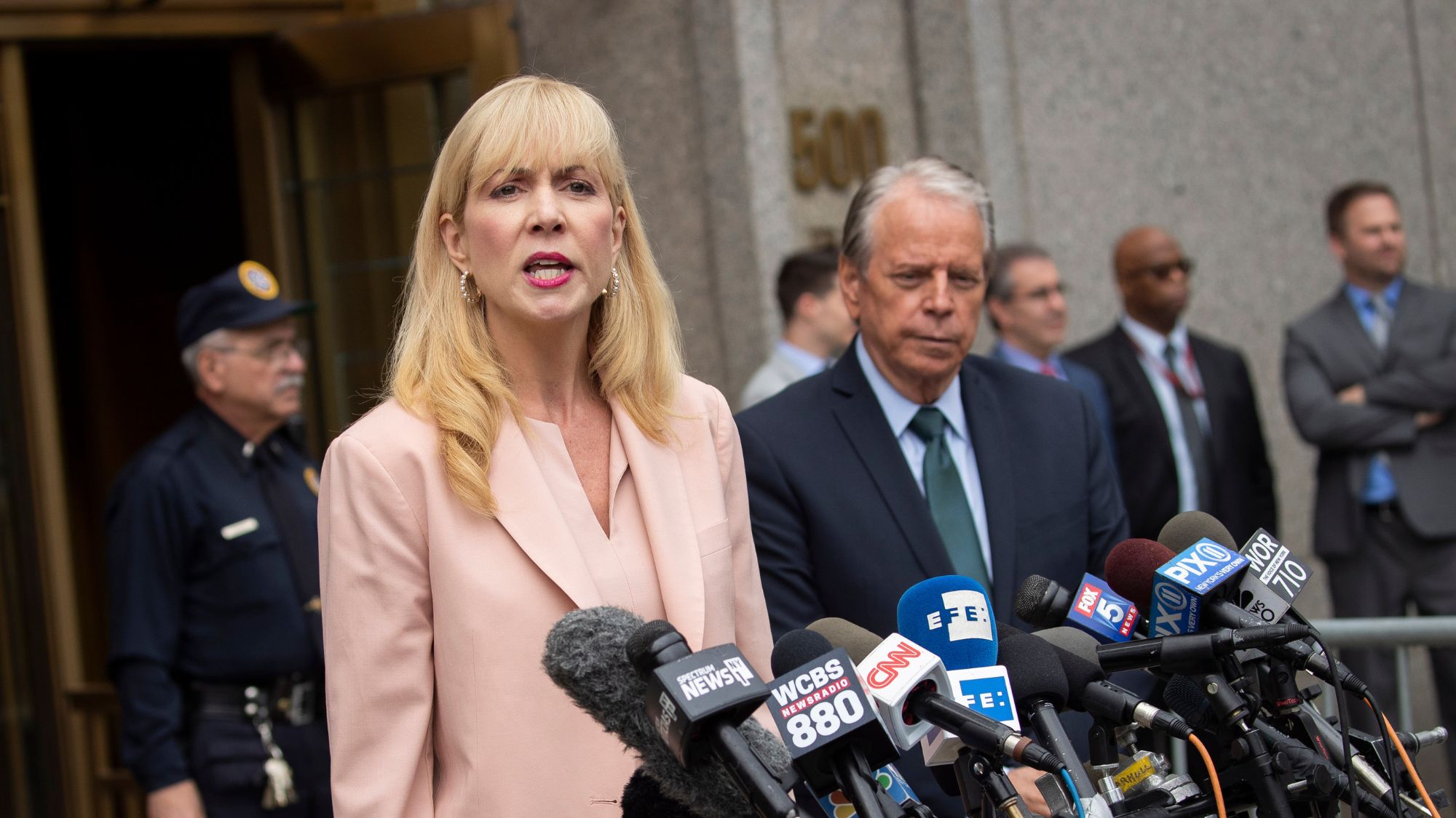 Sigrid McCawley speaks to reporters outside of federal court in 2019