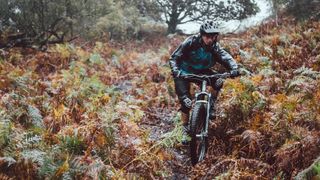 Wet rider on a trail