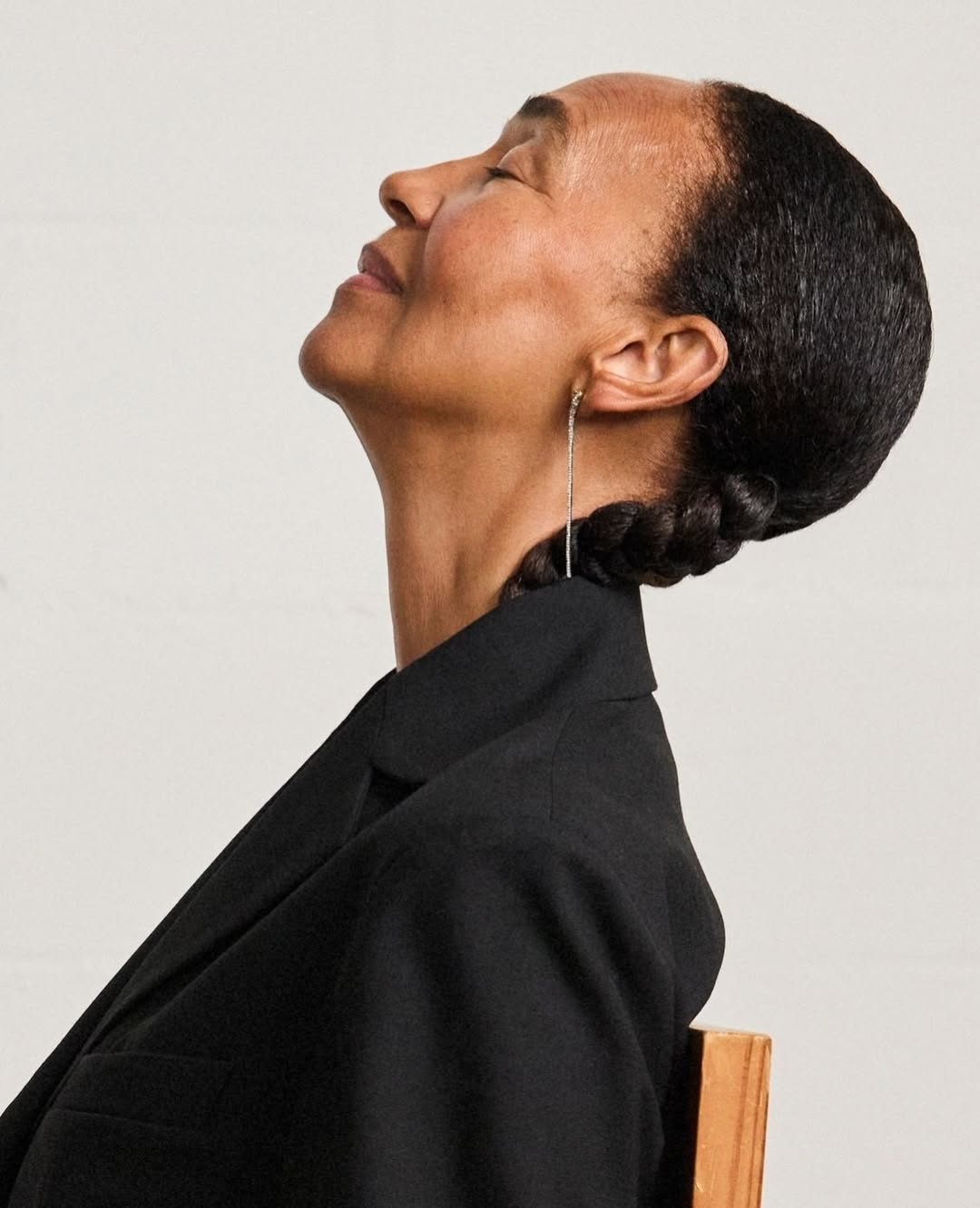 Laura Vann Jewellery model wears black blazer drop earrings
