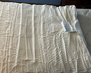 Tempur-Pedic Mattress topper unwrapped on white mattress