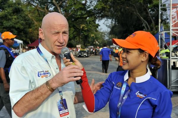 Race Director Michael Robb is interviewed at the start in Muar