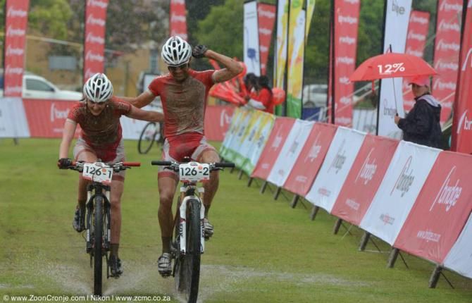 Cube Nutswerk MTB's Birgit Lavrijssen (left) and Marco Minnaard celebrate winning the Mixed category on Stage 5