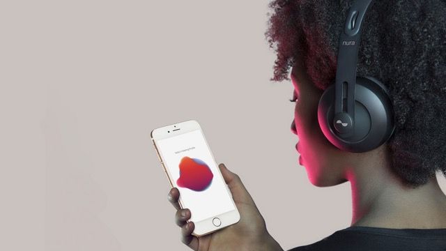 Woman listening to music with phone and headphones