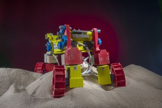 Built with multifunctional appendages able to spin wheels that can also be wiggled and lifted, this mini rover was modeled on the design of NASA’s Resource Prospector 15 prototype. The colorful little robot was used in the laboratory to develop and test complex locomotion techniques robust enough to help it climb hills composed of granular material, here ordinary beach sand.