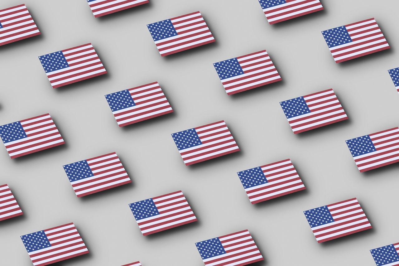 Grid pattern of American flags floating