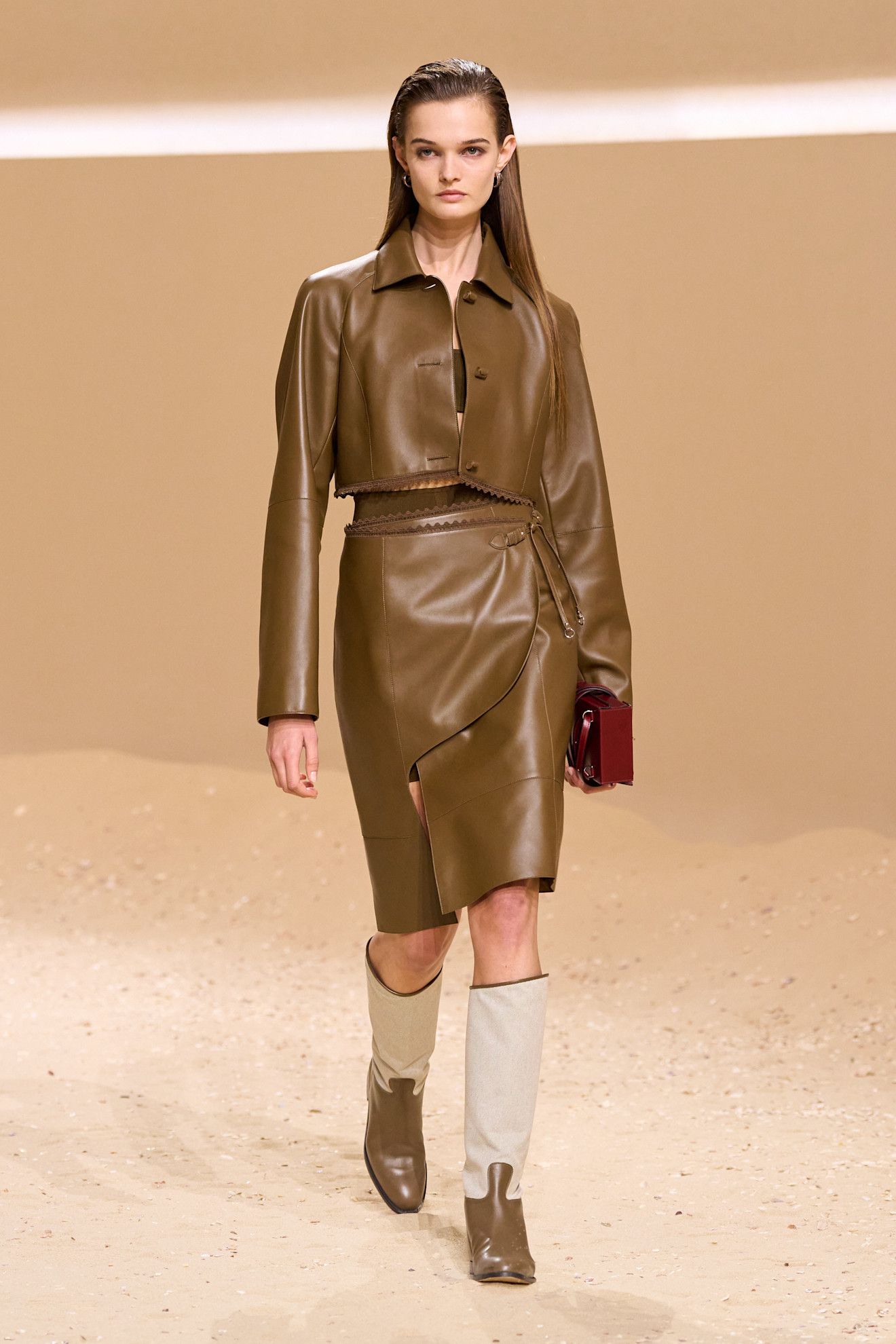 A model walks the hermes spring 2026 runway show in paris.