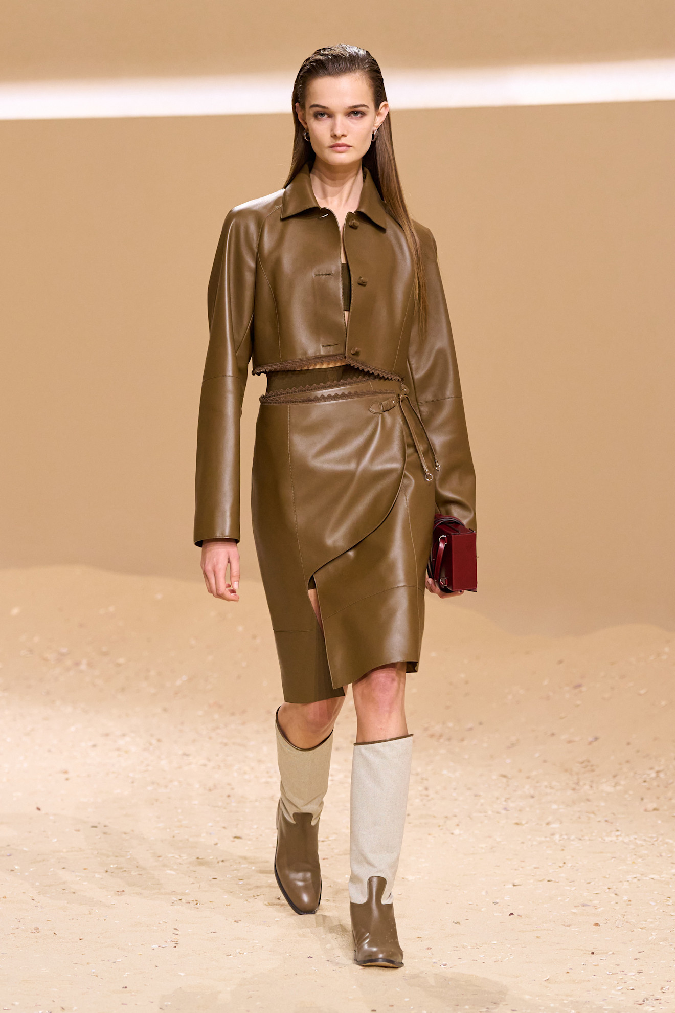 A model walks the hermes spring 2026 runway show in paris.