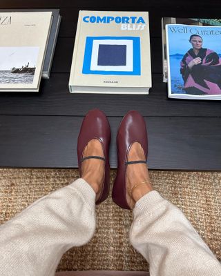 Influencer wears burgundy mary janes.