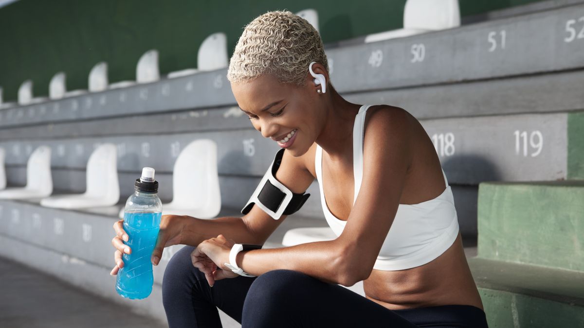 Woman checking sports watch after a workout